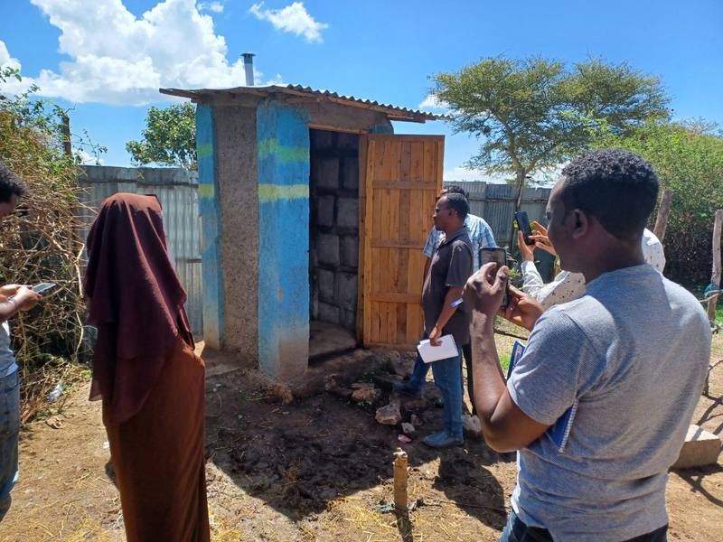Visitors at a finished household toilet