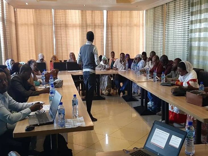 A scoping workshop with stakeholders around a meeting table