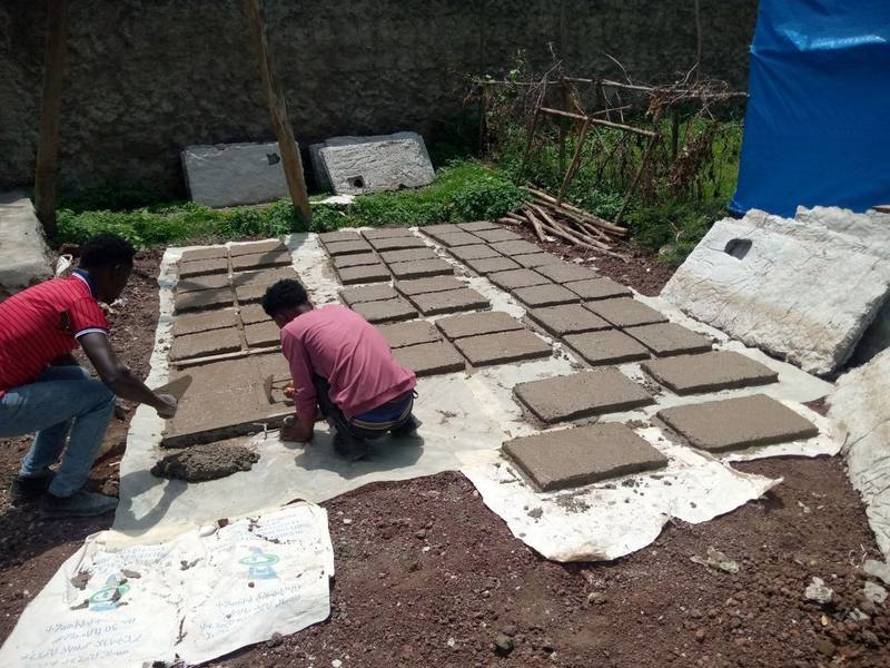 Workers casting panels at a local enterprise yard